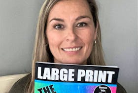 Crystal Pellerine displays her first published word search challenge book. With a large print format and glossy cover, she says it is intended for teens, adults and seniors.
