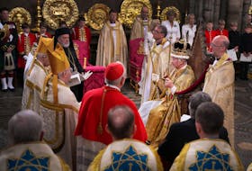 King Charles III, wearing St Edward's Crown, surrounded by faith leaders during his coronation ceremony in Westminster Abbey in London on May 6, 2023. Victoria Jones/Pool via REUTERS