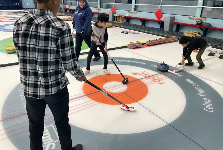 Youth with the Black Rock Initiative take to ice to do some curling. The initiative's goal is to provide BIPOC youth with the opportunity to participate in the sport. Contributed