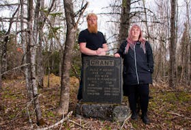 Devon Keizer and Kendra Hartling are seen in the gravesite on their Hopewell property on Monday, May 15, 2023. They're hoping to find out more information about the Grant family buried there. 
Ryan Taplin - The Chronicle Herald