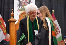 UPEI chancellor Catherine Callbeck, left, congratulates Larissa French on winning the Dr. Margaret F. Munro Bachelor of Science in Nursing Graduation Award during a convocation ceremony at UPEI on May 16. Dave Stewart • The Guardian