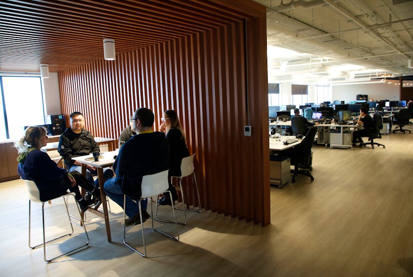 Workers chat at the new Ubisoft office in Halifax on Tuesday May 16, 2023. - TIM KROCHAK/THE CHRONICLE HERALD