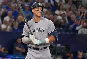 New York Yankees' Aaron Judge reacts after striking out against Toronto Blue Jays starting pitcher Kevin Gausman during a game in Toronto on Tuesday, May 16 2023. 