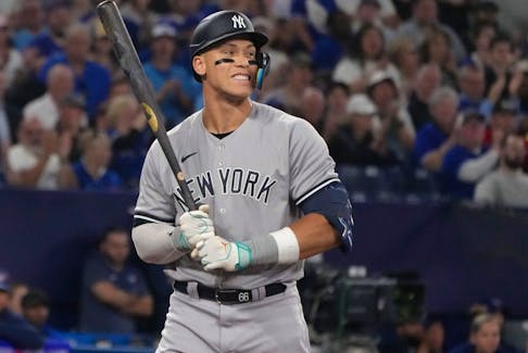 New York Yankees' Aaron Judge reacts after striking out against Toronto Blue Jays starting pitcher Kevin Gausman during a game in Toronto on Tuesday, May 16 2023. 