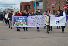The annual Walk in Silence for Victims of Family Violence wound its way through the streets of downtown Charlottetown on May 17. Carrying the premier’s action committee banner on the right are Danya O’Malley, left, chair of the premier’s action committee on family violence prevention, and Justice and Public Safety Minister Bloyce Thompson. Carrying the P.E.I. Family Violence Prevention Services Inc. banner are, from left, Alanna Jankov, deputy mayor of Charlottetown, Charlottetown Mayor Philip Brown, Charlottetown Coun. Norman Beck,  Emily Anne Fullerton, who works with P.E.I. Family Violence Prevention Services Inc., and Brad MacConnell, chief of Charlottetown Police Services. The event aims to raise awareness about family violence prevention and provide support for victims. Family Violence Prevention Week takes place May 15-21 and features a range of community walks, family events, workshops and information sessions. Dave Stewart • The Guardian