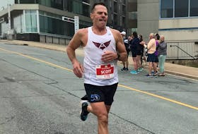 Scott Clark of Summerside races toward the finish line during the men's full marathon race at the 2022 Blue Nose Marathon in Halifax. The Blue Nose celebrates its 20th year this weekend and Clark will compete in the event for a 20th time. - CONTRIBUTED