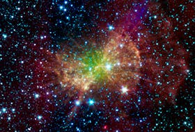 The Dumbbell nebula, also known as Messier 27, pumps out infrared light in this image from NASA Spitzer Space Telescope. What cannot be seen in any image from space is dark matter, a hypothetical form of matter believed to comprise 85 per cent of all the matter in the cosmos. Courtesy of NASA Image and Video Library
