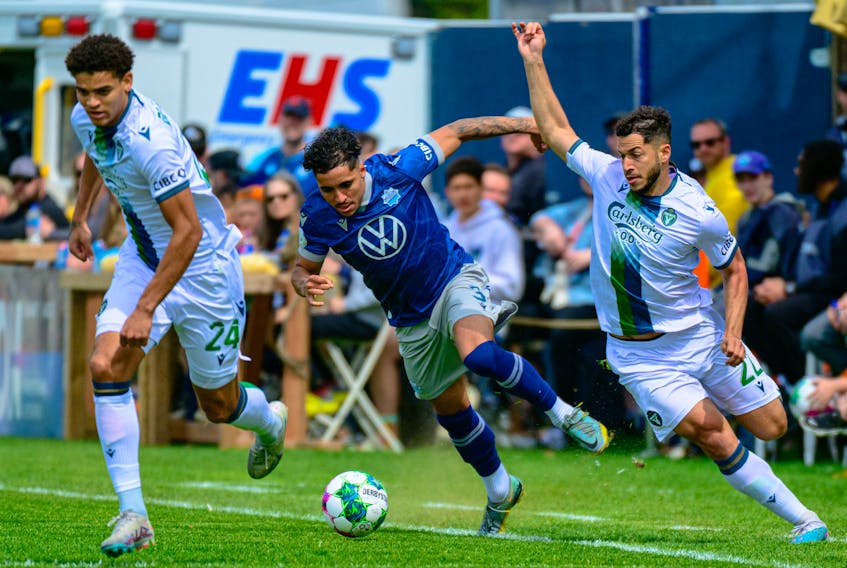HFX Wanderers defender Zachary Fernandez eludes York United's Osaze De Rosario and Austin Ricci during Canadian Premier League action Saturday afternoon at the Wanderers Grounds. York won 3-0. - TREVOR MacMILLAN / CANADIAN PREMIER LEAGUE