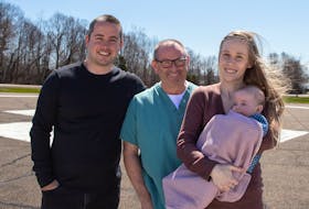 At the QEH helipad are baby Maren Lake, held by her mother, Shae-Lynn, with her father, Jordan, left, and her papa, Paul Higginbotham, RN. Contributed