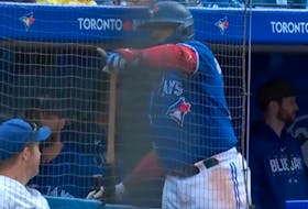 Vlad Guerrero Jr. points out a young fan to give a bat to during the game against the Orioles on Saturday, May 20, 2023.