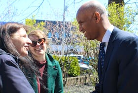 Federal Housing and Diversity and Inclusion Minister Ahmed Hussen greets Ally Centre director Christine Porter, left, and New Dawn project manager Alyce MacLean Tuesday in Sydney at a rapid housing announcement. BARB SWEET/CAPE BRETON POST