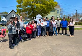 On May 24, more than a dozen Summerside residents gathered near the city's Community Fridge for a rally to raise awareness about homelessness in P.E.I. – Kristin Gardiner/SaltWire