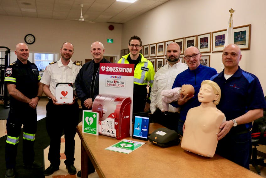 A joint effort between the Wolfville Fire Department and the Black River Lake Association this spring resulted in the remote community receiving an automated external defibrillator (AED) and residents receiving CPR and AED training. From left are paramedic and firefighter Capt. Ken White, Deputy Chief Chad Schrader, Capt. Doug Ross, Nova Scotia AED Registry co-ordinator Mike Janczyszyn, Chief Todd Crowell, vice-president of the Black River Lake Association Sean Hennessey, and Safety Response First Aid Training owner Roger Owen. The Greenwich Fire Department also donated an AED to the community group.