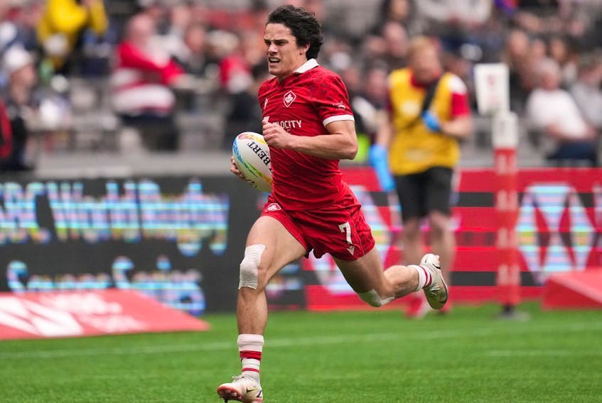 Canada's Brock Webster runs for his second try against Scotland during HSBC Canada Sevens rugby action in Vancouver on April 17, 2022.