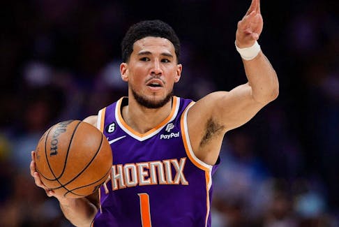 Phoenix Suns guard Devin Booker (1) controls the ball during a playoff game.