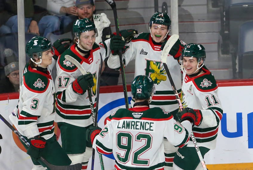 Halifax Mooseheads Alexandre Doucet is all smiles (top) as he celebratrs his goal with teammates against the  Sherbooke Phoenix during QMHL action in Halifax Saturday January 14, 2022.

TIM KROCHAK PHOTO