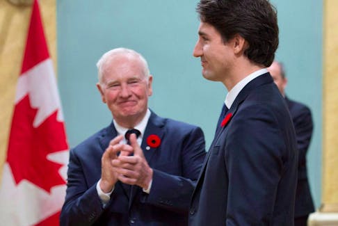 Governor General David Johnston applauds as he presents Prime Minister Justin Trudeau following his swearing-in during a ceremony at Rideau Hall in 2015. 