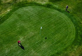 Ready to putt

Two golfers finish a hole at the new and now-opened Bally Haly golf course Wednesday afternoon. See a related story on page B1. — Keith Gosse/The Telegram