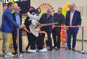 Co-owners Doug Doucet and Arnold Hagen (left) are joined by the mall's mascot Hub Cat, Truro Mayor Bill Mills, Millbrook First Nations Chief Bob Gloade and MLA Dave Ritcey for the ribbon cutting. Brendyn Creamer