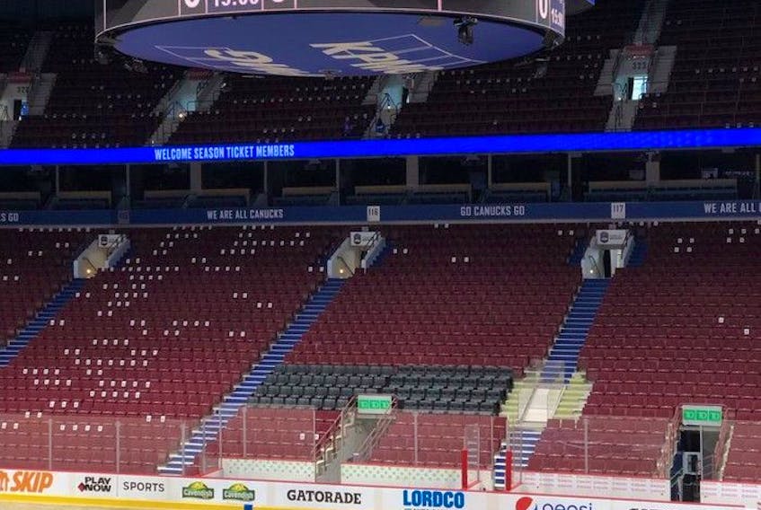  New black seats are being installed between the team benches at Rogers Arena.