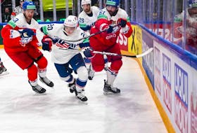 USA defenceman Lane Hutson, 20, outraces Czech forward Martin Kaut, right, during quarterfinal action at the IIHF World Championships in Tampere, Finland, on Thursday.