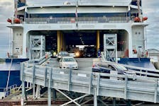 Vehicles drive off The Cat ferry after arriving in Yarmouth on the ferry's first crossing from Bar Harbor, Maine, of the 2023 sailing season. TINA COMEAU