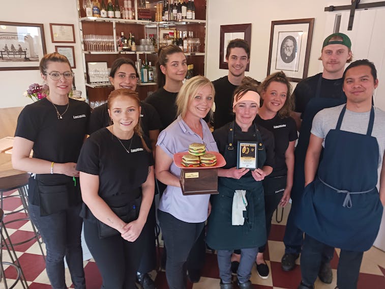 The team at Longfellow Restaurant were excited to receive the People’s Choice Award for Burger Wars 2023. Front row, from left, Hannah Rushton, Teresa Brown, Jessica Jordan, Tim Llorera. Second row, Kayla Casey, Tyreen Kapoor, Samar Nagiar, Will Mercer, Shyanne Murray and Destin Daisley. Contributed photos