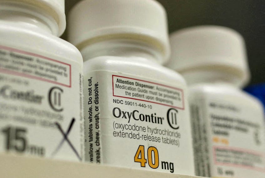 FILE PHOTO: Bottles of prescription painkiller OxyContin, 40mg pills, made by Purdue Pharma L.D. sit on a shelf at a local pharmacy, in Provo, Utah, U.S., April 25, 2017. REUTERS/George Frey  Pill bottles.