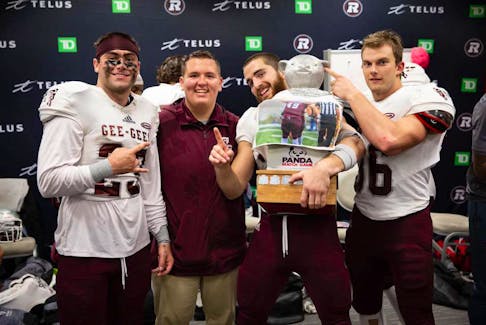 Robert Greeley (middle) started his turn in digital media with the University of Ottawa’s football team. He’s shown here with, from left, Ryed Kessler, Thomas Carrier and Kyle Rodger. Contributed photo