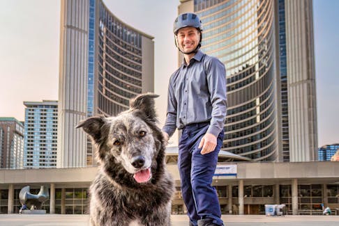 Molly the dog and owner Toby Heaps, who says he is running for Toronto mayor on behalf of the dog. 