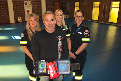 Steve Nickerson purchased an automated external defibrillator (AED) for East Coast Aikido in Greenwood after he had a heart attack in January. He had a chance on May 24 to thank the paramedics who saved him as part of Paramedic Services Week. From left are Brittany Cunningham, Nickerson, Amanda MacIntosh and Jenny Haynes.
Jason Malloy