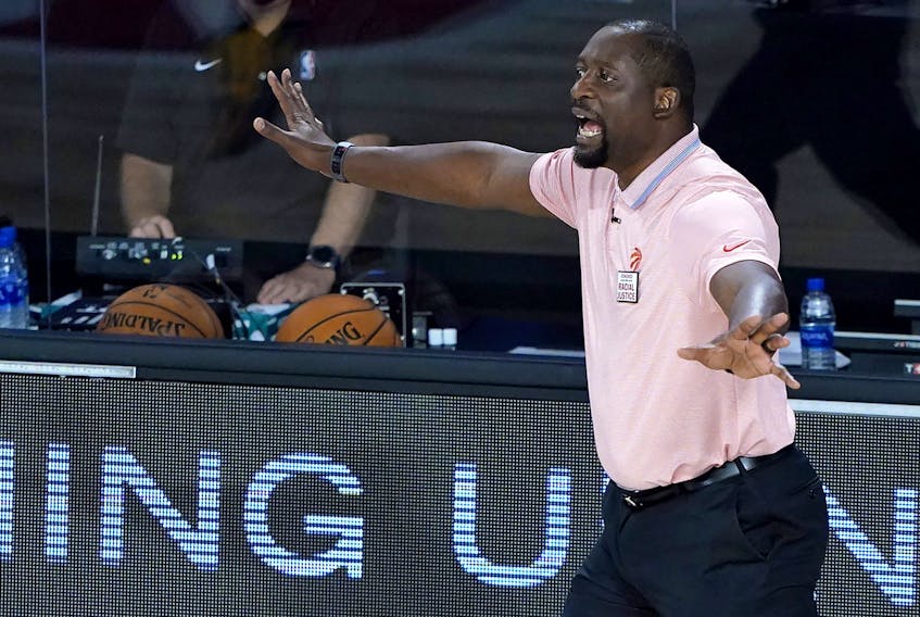 Assistant coach Adrian Griffin of the Toronto Raptors reacts during first-half action against the Philadelphia 76ers after head coach Nick Nurse stepped down for the night to let Griffin coach at The Field House at ESPN Wide World Of Sports Complex on August 12, 2020 in Lake Buena Vista, Florida.  
