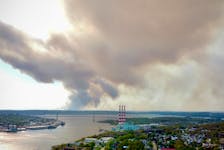 Smoke from a wildfire in the Upper Tantallon area is visible over Halifax Harbour early Sunday evening.