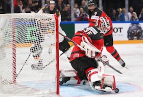 Canada goalkeeper Samuel Montembeault makes a save during the IIHF World Hockey Championship final match between Canada and Germany in Tampere, Finland, on May 28, 2023.