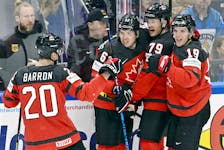 Ice Hockey - IIHF World Ice Hockey Championship 2023 - Final - Canada v Germany - Nokia Arena, Tampere, Finland - May 28, 2023 Canada's Samuel Blais celebrates scoring their first goal with teammates Jussi Nukari/Lehtikuva via REUTERS  ATTENTION EDITORS - THIS IMAGE WAS PROVIDED BY A THIRD PARTY. NO THIRD PARTY SALES. NOT FOR USE BY REUTERS THIRD PARTY DISTRIBUTORS. FINLAND OUT. NO COMMERCIAL OR EDITORIAL SALES IN FINLAND.  Halifax's Justin Barron (20) celebrates a goal with Canadian teammates, from left, Jake Neighbours, Samuel Blais and Peyton Krebs in the championship game against Germany at the IIHF world hockey championship on Sunday in Tampere, Finland. Canada won the game 5-2. - Jussi Nukari / Reuters