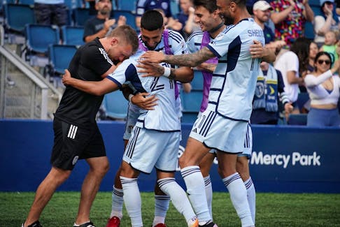 Sporting Kansas City midfielder Felipe Hernandez (21) celebrates with teammates after a goal against the Portland Timbers.