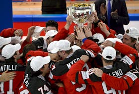 Canadian players celebrate winning the IIHF World Ice Hockey Championship 2023 with the trophy on Sunday at the Nokia Arena in Tampere, Finland. - Jussi Nukari / Lehtikuva via Reuters