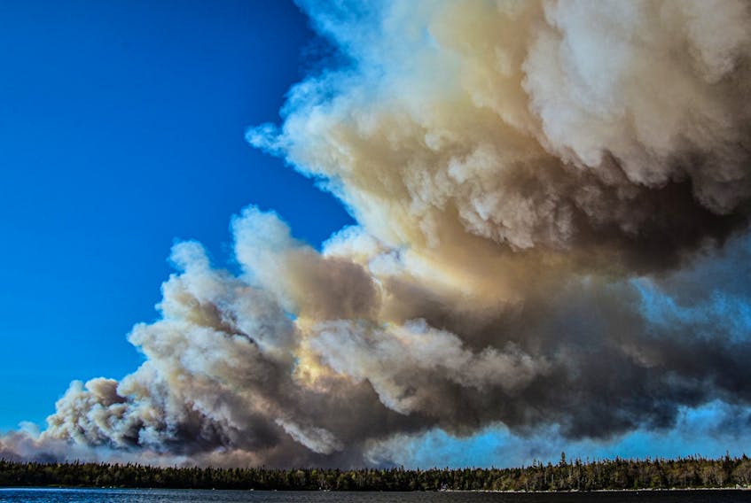 Thick smoke billowed from a wildfire in Barrington on May 27. The wildfire is in the Barrington region has been burning out control for days and by May 29 had burned over 6,270 hectares.