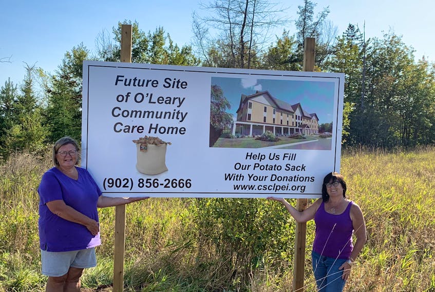 Holly Silliker, left, and Rev. Bethe Benjamin Cameron stand on Royal Avenue in O'Leary, the lot of The Willows – O'Leary's newest community care facility. The project is expected to be finished by January 2024. File