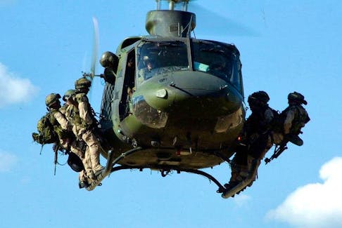 Canada Troops from the Canadian Special Operations Regiment (CSOR) prepare to rappel from a CH-146 Griffon helicopter during a training exercise near Kamloops, BC.  