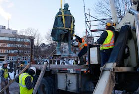 The statue of Edward Cornwallis is lifted from its base on Jan. 31, 2018 in the Halifax park once named for the city's founder. Tim Krochak/The Chronicle Herald