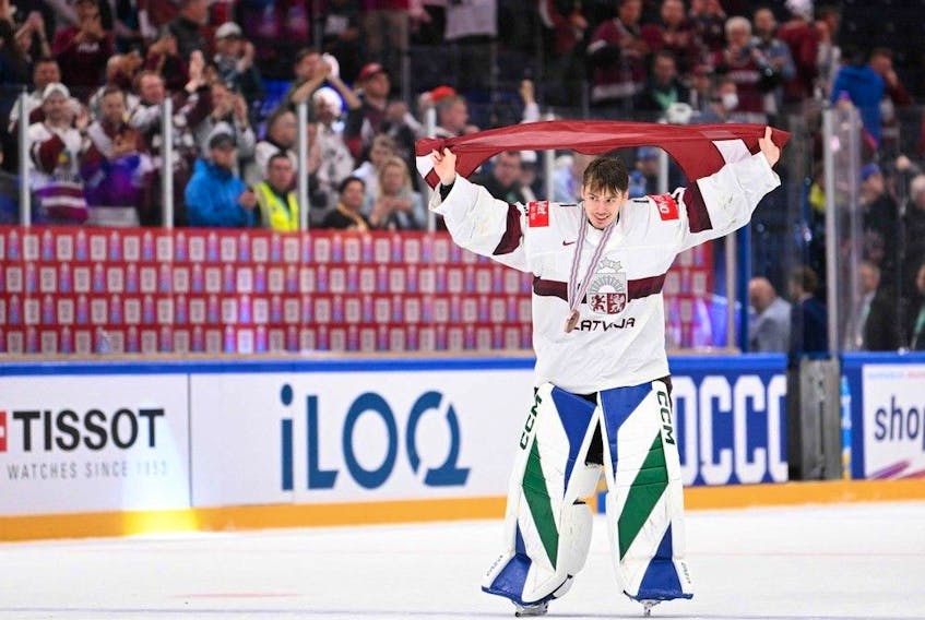 Latvia's goalkeeper Arturs Silovs celebrates after winning the IIHF Ice Hockey Men's World Championships third place play-off match betweeen United States and Latvia in Tampere, Finland, on May 28, 2023. (Photo by Jonathan NACKSTRAND / AFP)