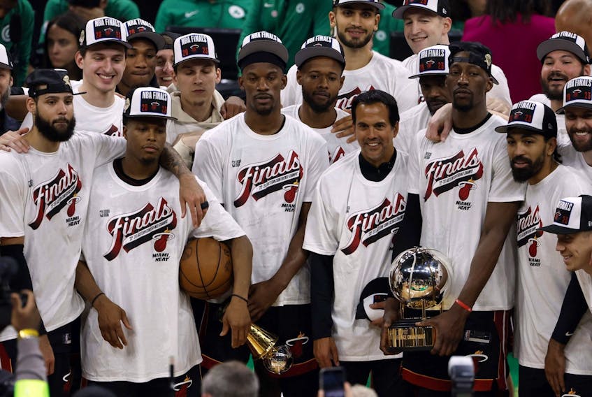 The Miami Heat celebrate on the podium after defeating the Boston Celtics in game seven of the Eastern Conference Finals for the 2023 NBA playoffs at TD Garden. May 29, 2023.   