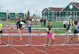 Athletes are shown competing in hurdles competition at the School Sport Nova Scotia Highland Region Track and Field Championships at Cape Breton Health Recreation Complex last weekend. Eight records were set during the event. CAPE BRETON POST PHOTO