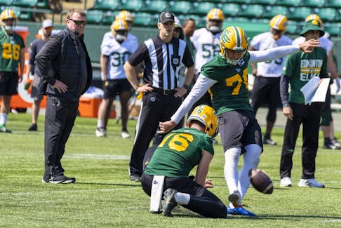 Head coach and general manager Chris Jones watches kicker Dean Faithfull at Edmonton Elks training camp on May 14, 2023, in Edmonton.