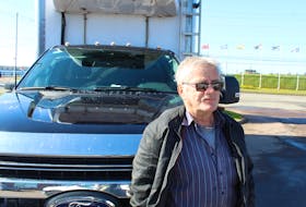 Ernie Maddix, owner of Maddix Seafoods, stands in front of his 2022 Ford F-550 in Charlottetown on May 27. His windshield was recently cracked by two separate drivers after gravel flew off the tops of their trucks and hit his car. Rafe Wright • The Guardian