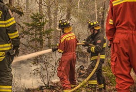 Hitting hotspots in the woods of Shelburne County where by the morning of May 30, an out-of-control wildfire that started in the Barrington Lake area had consumed more than 10,000 hectares. FRANKIE CROWELL PHOTO