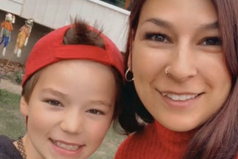 Carolann Robillard, 35, and her child Sara Miller, 11, who had started using the first name Jayden, pose in this undated handout photo. Both were killed in a May 5 random attack outside an Edmonton school. 