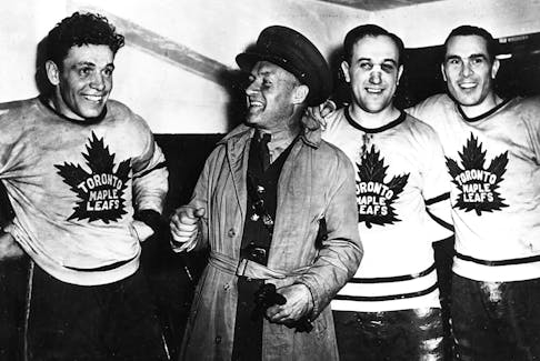 Former Maple Leafs GM Conn Smythe, second from left, in 1942.