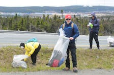 People help with the Outer Ring Road annual cleanup near the Team Gushue Highway exit ramps Sunday, May 28. JOE GIBBONS • THE TELEGRAM